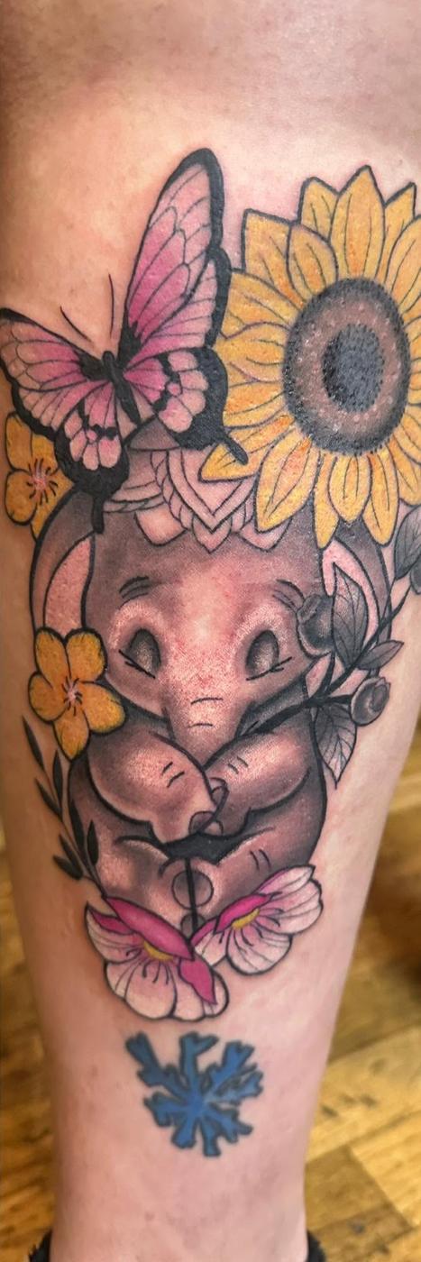 Color cartoon elephant among sunflowers and butterflies, on a leg